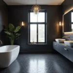 Modern luxury black bathroom with matte subway tiles, a white freestanding tub, brass chandelier, double floating vanity, and minimalistic decor.