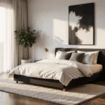 A luxurious modern minimalist bedroom bathed in golden morning light, featuring floor-to-ceiling windows, a black platform bed with white linens, brass nightstands, an oversized abstract canvas, and a potted fiddle leaf fig.