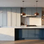 Photorealistic interior shot of a modern kitchen with two-tone blue-gray cabinets, a white quartz waterfall island, and brass accents, illuminated by golden hour light streaming through large windows, showcasing minimalist design elements and warm wooden accents.