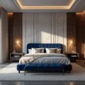 Photorealistic wide-angle view of an opulent master bedroom at golden hour, featuring a sapphire blue tufted velvet headboard, Egyptian cotton linens, and polished concrete floors, with dramatic shadows cast by natural light filtering through sheer curtains, and a twilight cityscape visible through panoramic windows.