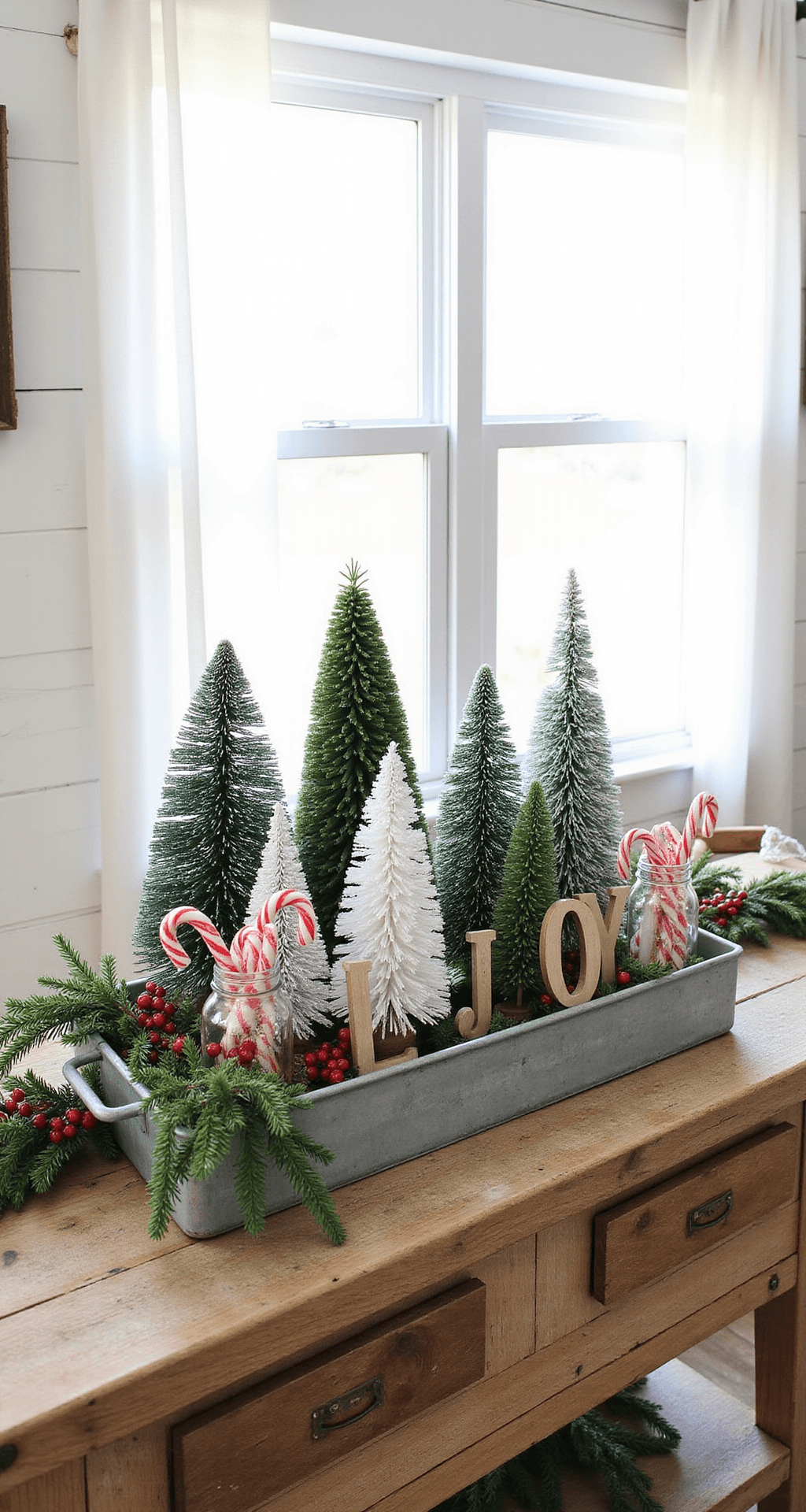 Christmas Tray Décor Ideas That'll Make Your Home Look Like a Holiday Magazine Spread A weathered galvanized metal tray on a reclaimed wood console table, filled with mini Christmas trees, vintage mason jars with candy canes, and wooden 'JOY' letters, all set against white shiplap walls in soft morning light.